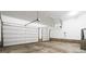 Spacious two-car garage featuring white walls, concrete floor, and overhead door openers at 4251 Perry St, Denver, CO 80212
