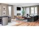 Spacious living room with a modern fireplace, comfortable seating, and an open floor plan leading to the dining area at 4251 Perry St, Denver, CO 80212