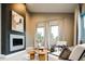 Cozy living room with a modern fireplace and bright, natural light at 4251 Perry St, Denver, CO 80212