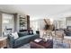 Bright and airy living room featuring modern furniture, a stylish rug, and an open staircase at 4251 Perry St, Denver, CO 80212