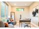 Bright home office featuring modern furniture, a large window, and contemporary decor, ideal for productivity at 4251 Perry St, Denver, CO 80212