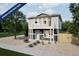 Two-story home with gray siding, white trim, small balcony, and minimal landscaping at 46565 Avery Ln, Bennett, CO 80022