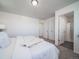 Spacious main bedroom with carpet, neutral paint, and ensuite bathroom at 46565 Avery Ln, Bennett, CO 80022