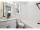 Bright bathroom with white tile, modern vanity, and sleek fixtures at 1255 Penner Dr, Erie, CO 80026