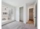 Inviting bedroom features neutral carpet, large window views and closet doors leading to a storage area at 1255 Penner Dr, Erie, CO 80026