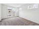 Spacious bedroom featuring neutral carpet and multiple large windows at 1255 Penner Dr, Erie, CO 80026
