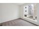 Bright bedroom features plush carpeting, a large window with neighborhood views, and fresh white walls at 1255 Penner Dr, Erie, CO 80026