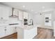 Modern kitchen with a center island, quartz countertop, stainless steel appliances, and sleek cabinetry at 1255 Penner Dr, Erie, CO 80026