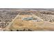 Aerial view of the neighborhood showcasing the proximity to a school and park at 844 Dakota Ln, Erie, CO 80516