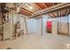 Unfinished basement with exposed utilities, exposed ceiling joists, and a sauna at 844 Dakota Ln, Erie, CO 80516