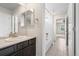 Well-lit bathroom featuring a single sink vanity and a shower/tub combo at 844 Dakota Ln, Erie, CO 80516