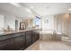 Spacious bathroom featuring a soaking tub, double vanity, and walk-in shower at 844 Dakota Ln, Erie, CO 80516