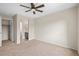 Bedroom with carpet and adjacent bathroom at 844 Dakota Ln, Erie, CO 80516