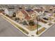 Inviting two-story home featuring a well-manicured lawn and solar panels for energy efficiency at 844 Dakota Ln, Erie, CO 80516