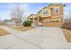 Charming two-story home with a two-car garage, a well-maintained yard, and a welcoming entrance at 844 Dakota Ln, Erie, CO 80516