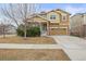 Inviting two-story home with a two-car garage, landscaped front yard, and neutral-toned exterior at 844 Dakota Ln, Erie, CO 80516