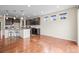 Eat-in kitchen with modern appliances, dark cabinets, and a large island with bar stool seating at 844 Dakota Ln, Erie, CO 80516