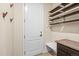 Mud room features a bench, cabinets, hooks, and shelves at 844 Dakota Ln, Erie, CO 80516