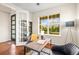 Stylish home office with hardwood floors, large windows, and a modern desk, perfect for remote work at 844 Dakota Ln, Erie, CO 80516