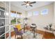 Bright office featuring hardwood floors, a large window, and a contemporary desk setup at 844 Dakota Ln, Erie, CO 80516