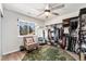 Bedroom includes an open closet system for ample storage and a large window for natural light at 9077 W 88Th Cir, Denver, CO 80021