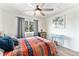 Bedroom is a cozy space with a window for natural light and stylish decor at 9077 W 88Th Cir, Denver, CO 80021