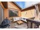 Cozy wooden deck includes stylish outdoor seating and a view of the surroundings at 9077 W 88Th Cir, Denver, CO 80021