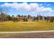Scenic aerial view of the golf course, highlighting lush greenery and surrounding landscaping at 7831 Inverness Blvd, Englewood, CO 80112