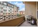 Outdoor balcony area with grill overlooking surrounding buildings and beautiful blue skies at 7831 Inverness Blvd, Englewood, CO 80112