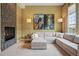Comfortable living room with fireplace and large sectional for ultimate relaxation at 7831 Inverness Blvd, Englewood, CO 80112