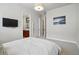 Comfortable bedroom with attached bathroom featuring an ensuite bathroom and modern decor at 7831 Inverness Blvd, Englewood, CO 80112