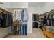 Spacious walk-in closet with organized shelving and hanging racks at 7831 Inverness Blvd, Englewood, CO 80112