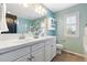 Bathroom featuring double sinks, a toilet, and a large mirror at 10978 Ashurst Ln, Highlands Ranch, CO 80130