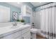 Bathroom featuring a white vanity, framed mirror, updated lighting, and shower with a bathtub at 10978 Ashurst Ln, Highlands Ranch, CO 80130