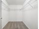 Walk-in closet with metal shelving and carpet flooring at 10978 Ashurst Ln, Highlands Ranch, CO 80130