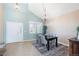 Elegant dining room with vaulted ceilings, chandelier lighting, and plenty of natural light at 10978 Ashurst Ln, Highlands Ranch, CO 80130
