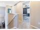 Upstairs hallway with carpet and views of a bedroom with a ceiling fan at 10978 Ashurst Ln, Highlands Ranch, CO 80130
