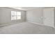 Spacious bedroom with large window and neutral carpeting, perfect for relaxation at 14249 Beebalm Ave, Parker, CO 80134