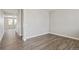 Spacious room with wood-look flooring and large window overlooking the front yard at 14249 Beebalm Ave, Parker, CO 80134