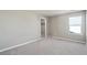 Empty bedroom with soft carpet and plenty of natural light from the windows at 14249 Beebalm Ave, Parker, CO 80134