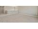 Spacious room with neutral carpet and large window overlooking the backyard at 14249 Beebalm Ave, Parker, CO 80134