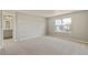 Bright bedroom featuring a neutral color scheme, soft carpeting and large window at 14249 Beebalm Ave, Parker, CO 80134