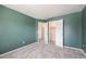 Bedroom featuring plush carpeting and large closet with ample storage space at 17045 Hastings Ave, Parker, CO 80134