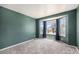 Bedroom featuring a bay window with natural light and new carpet at 17045 Hastings Ave, Parker, CO 80134