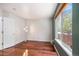 Light-filled bedroom with hardwood floors, a window with backyard view and freshly painted walls at 17045 Hastings Ave, Parker, CO 80134