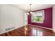 Cozy dining room with hardwood floors and a decorative chandelier at 17045 Hastings Ave, Parker, CO 80134