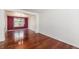 Dining room area featuring hardwood floors and a large window at 17045 Hastings Ave, Parker, CO 80134