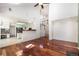Inviting living room with gleaming hardwood floors and an open layout, leading to the kitchen and upstairs at 17045 Hastings Ave, Parker, CO 80134
