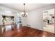 Spacious living area featuring hardwood floors and seamless flow into the kitchen at 17045 Hastings Ave, Parker, CO 80134