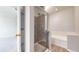 Bathroom featuring a glass enclosed shower and separate soaking tub at 16047 E Geddes Ln # 128, Aurora, CO 80016
